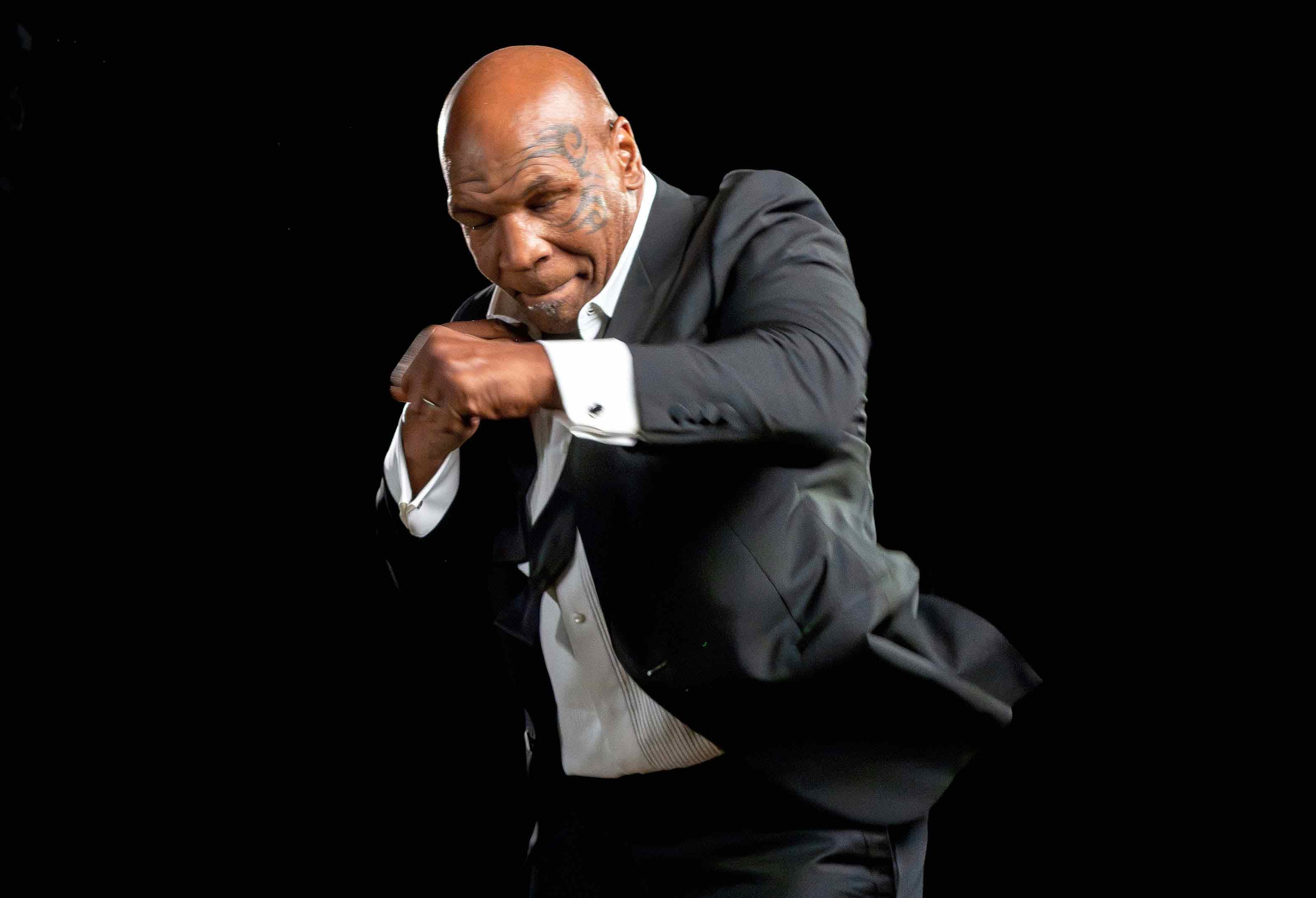 Mike Tyson posing with fists in air